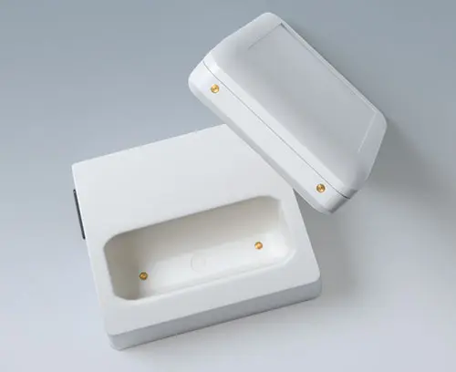 Enclosure and desk station with integrated contacts